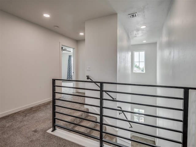 staircase with baseboards, carpet flooring, recessed lighting, and visible vents