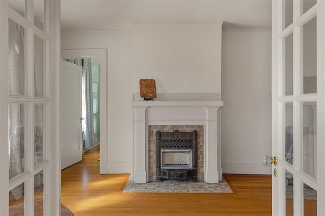201 NW 18th St, Oklahoma City, OK 73103 - living room featuring baseboards, ornamental molding, wood finished floors, and french doors