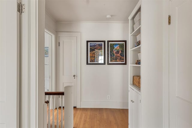 201 NW 18th St, Oklahoma City, OK 73103 - corridor featuring crown molding, baseboards, light wood finished floors, and built in shelves