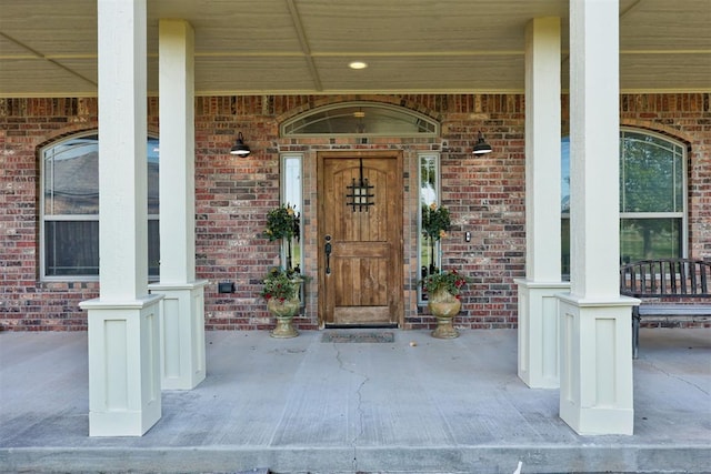 10608 Oaksplinter Ln, Oklahoma City, OK 73173 - property entrance with covered porch and brick siding