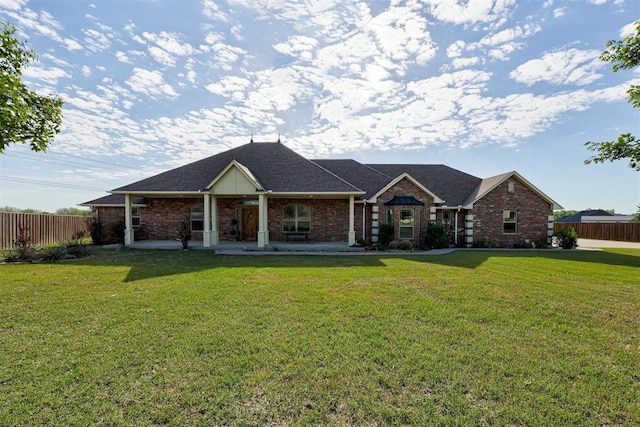 10608 Oaksplinter Ln, Oklahoma City, OK 73173 - single story home with brick siding, fence, a shingled roof, and a front yard