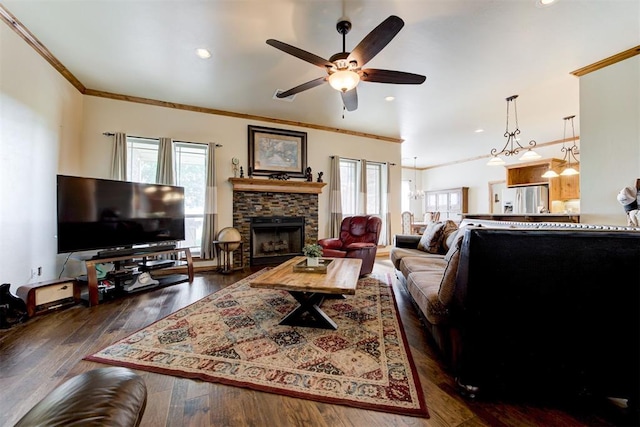 10608 Oaksplinter Ln, Oklahoma City, OK 73173 - living room with plenty of natural light, ornamental molding, ceiling fan, and a fireplace