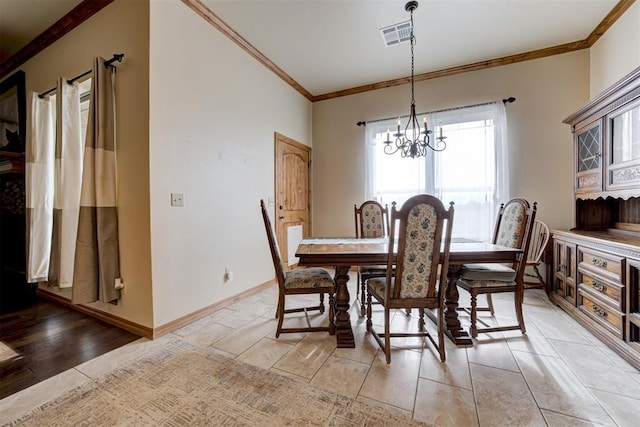 10608 Oaksplinter Ln, Oklahoma City, OK 73173 - dining space with an inviting chandelier, baseboards, crown molding, and visible vents