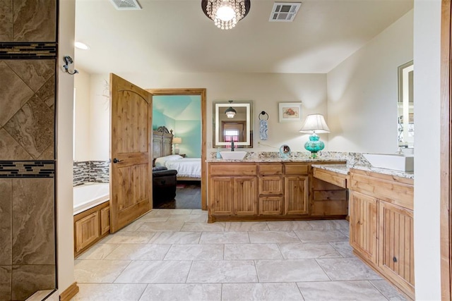 10608 Oaksplinter Ln, Oklahoma City, OK 73173 - full bathroom with a garden tub, ensuite bath, visible vents, and vanity