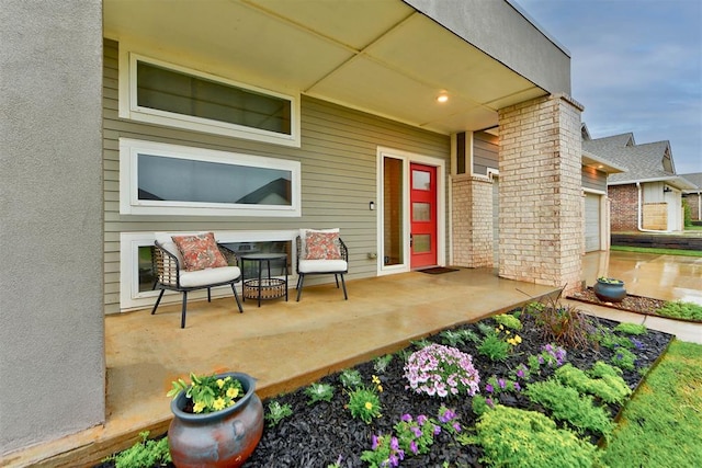 property entrance featuring brick siding