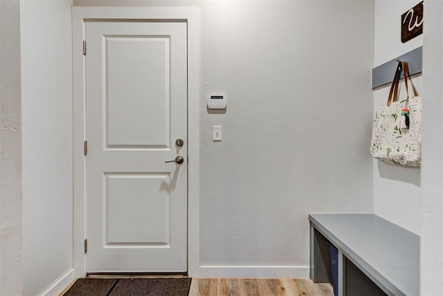 mudroom with baseboards and light wood-style floors