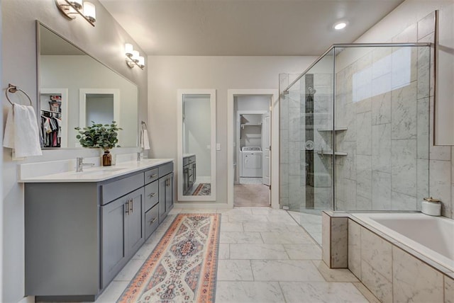 full bath with double vanity, a stall shower, a sink, marble finish floor, and a spacious closet