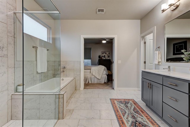 ensuite bathroom featuring visible vents, vanity, marble finish floor, ensuite bathroom, and tiled bath