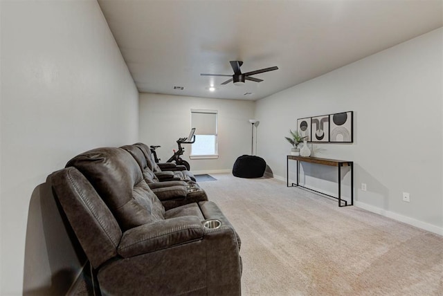carpeted living room featuring ceiling fan, visible vents, and baseboards