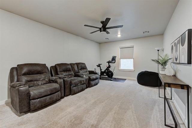 living room with carpet flooring, a ceiling fan, baseboards, and visible vents