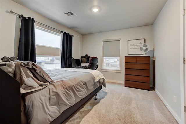bedroom featuring visible vents, carpet, and baseboards
