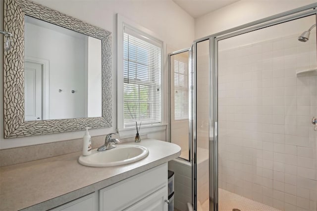 full bathroom featuring vanity and a shower stall