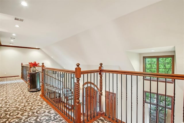 hall with recessed lighting, carpet flooring, baseboards, and visible vents