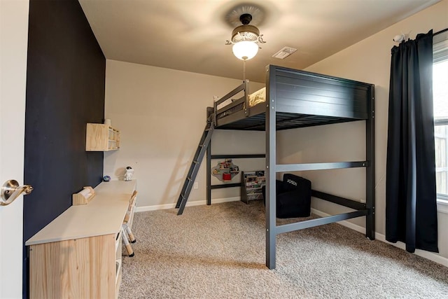 bedroom featuring light colored carpet, baseboards, and visible vents