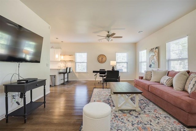 living room with baseboards, a ceiling fan, dark wood-style flooring, and visible vents