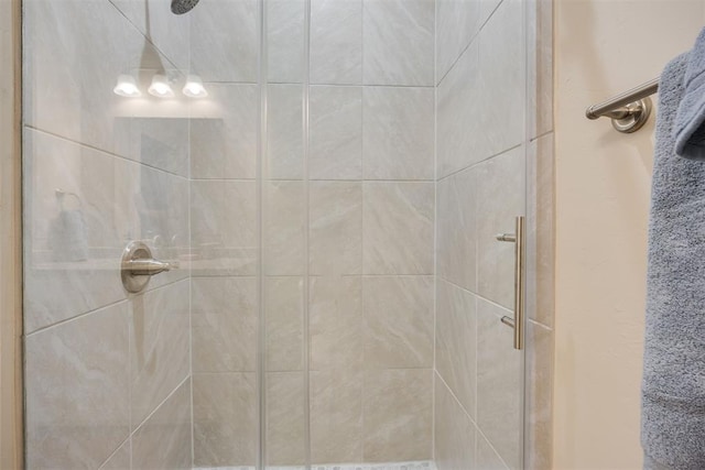 full bath featuring a shower stall