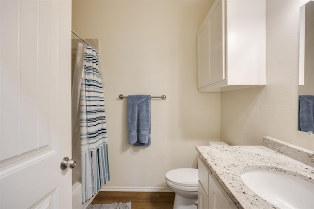 full bath featuring vanity, toilet, a shower with shower curtain, baseboards, and wood finished floors