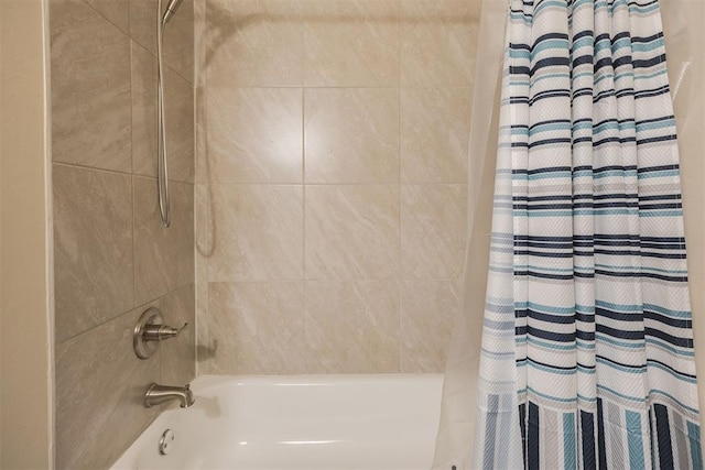 bathroom with shower / bath combination with curtain
