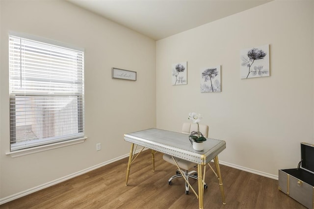 office area with baseboards and wood finished floors