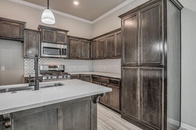 kitchen with backsplash, hanging light fixtures, dark brown cabinetry, and appliances with stainless steel finishes