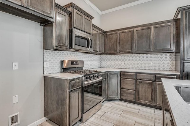 kitchen featuring decorative backsplash, dark brown cabinets, appliances with stainless steel finishes, and ornamental molding