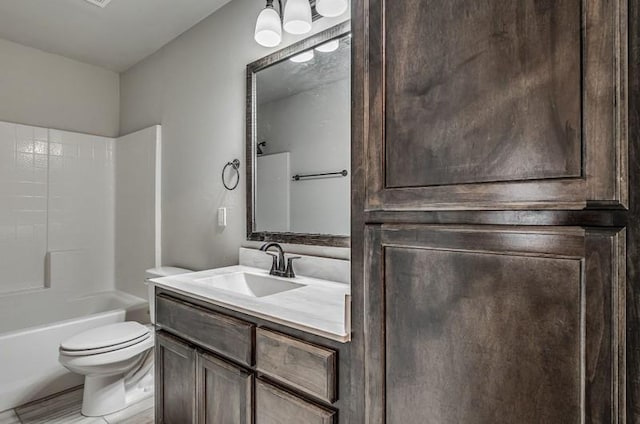 full bath featuring vanity, shower / bath combination, and toilet