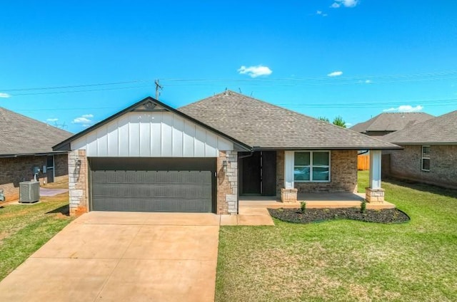ranch-style house featuring a front lawn, a shingled roof, an attached garage, driveway, and a porch