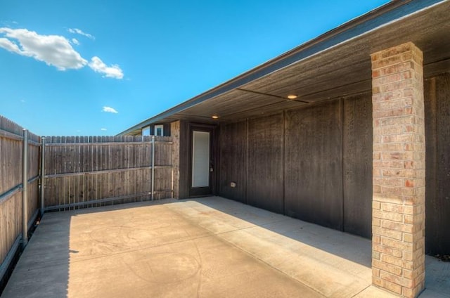 view of patio with fence