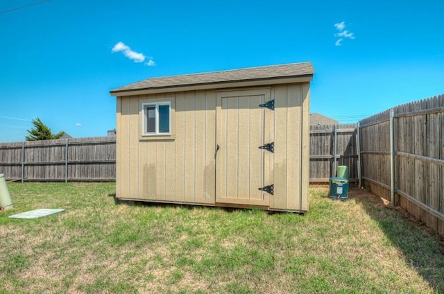 view of shed featuring a fenced backyard
