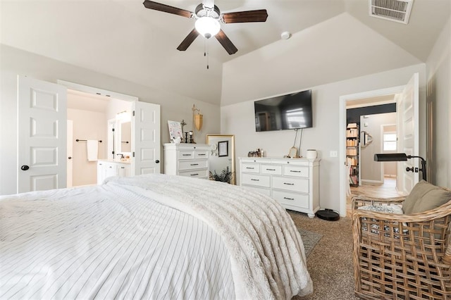 carpeted bedroom featuring lofted ceiling and ceiling fan