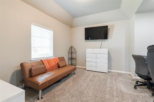 office space featuring carpet, baseboards, and lofted ceiling