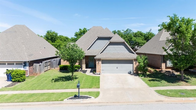view of front of property with an attached garage, brick siding, and driveway