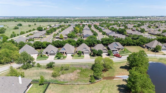 aerial view of residential area with a nearby body of water