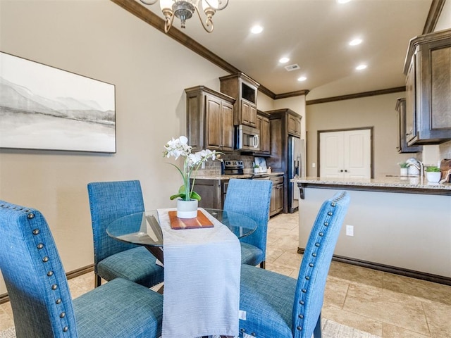 dining room featuring visible vents, crown molding, baseboards, a chandelier, and recessed lighting