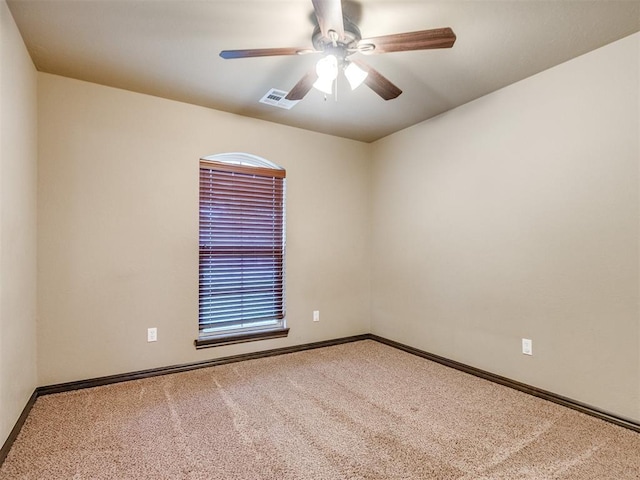 unfurnished room with a ceiling fan, baseboards, visible vents, and carpet