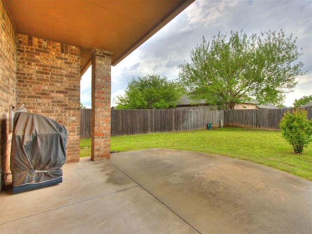 view of patio / terrace with area for grilling and a fenced backyard