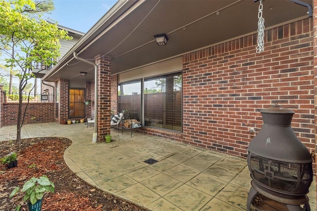 view of patio / terrace featuring fence
