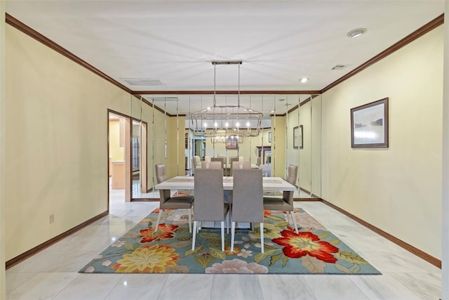 dining space featuring crown molding, baseboards, a notable chandelier, and visible vents