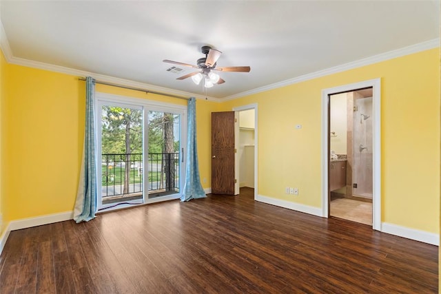 unfurnished bedroom with baseboards, crown molding, and wood finished floors