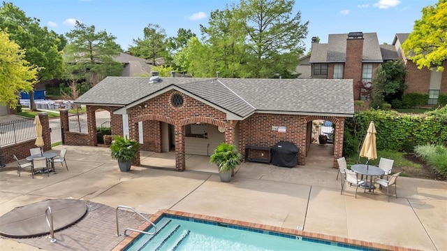 exterior space with fence and a patio area