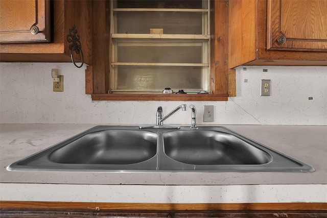 room details with a sink and brown cabinets