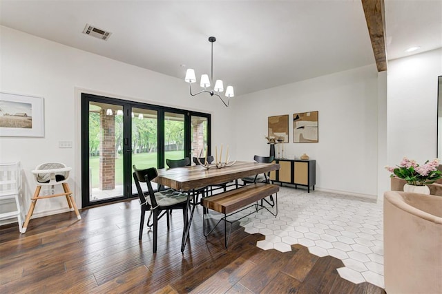 dining area with visible vents, wood finished floors, baseboards, an inviting chandelier, and recessed lighting
