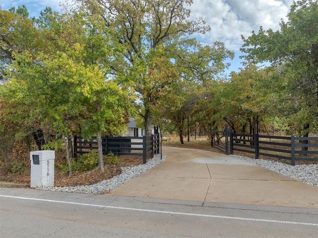 view of community with a fenced front yard