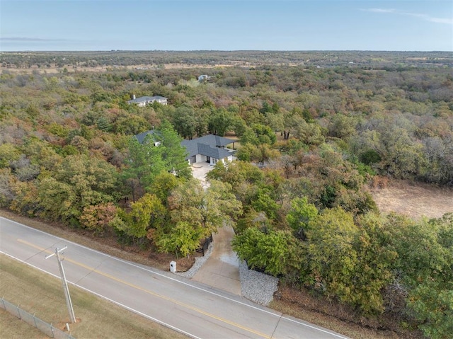 drone / aerial view with a view of trees