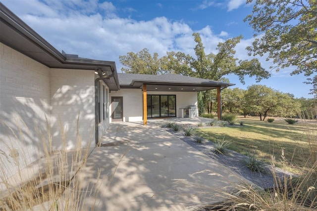 exterior space with a yard and a patio