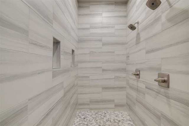 bathroom with tiled shower