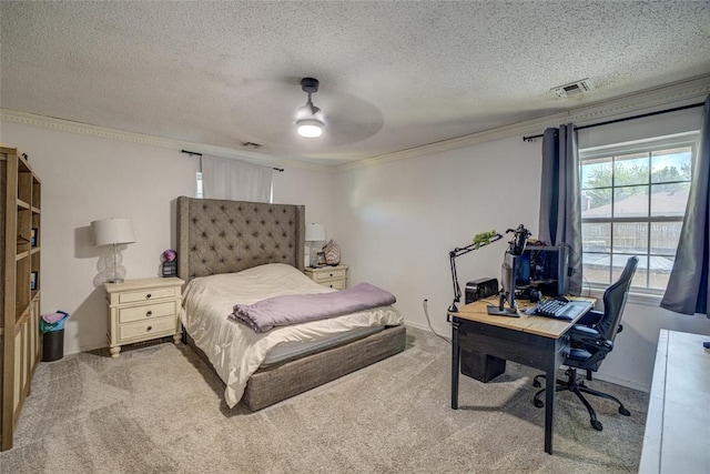 carpeted bedroom featuring a textured ceiling, visible vents, and ornamental molding