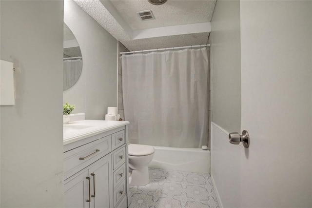 bathroom with visible vents, vanity, toilet, a textured ceiling, and shower / tub combo