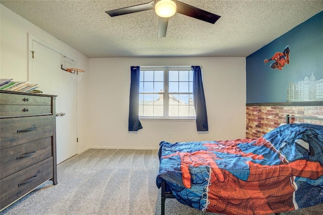 carpeted bedroom with a textured ceiling and ceiling fan