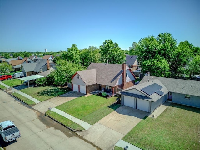 birds eye view of property with a residential view